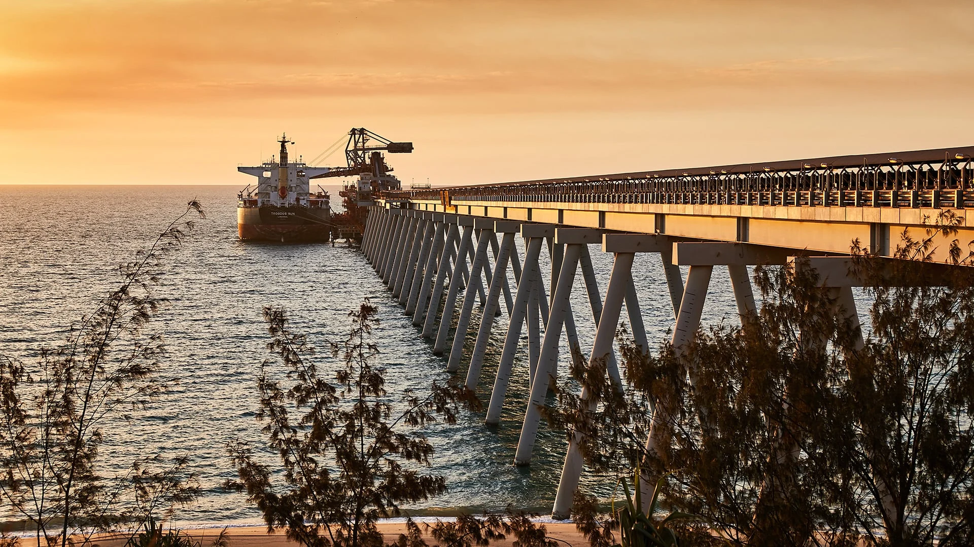 Export conveyor and ship-loading facility at Weipa in warm evening light